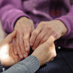 medical cannabis family caregiver holding hands